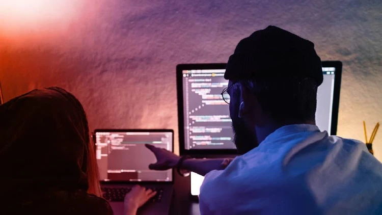 Developers working on code during a software development session.