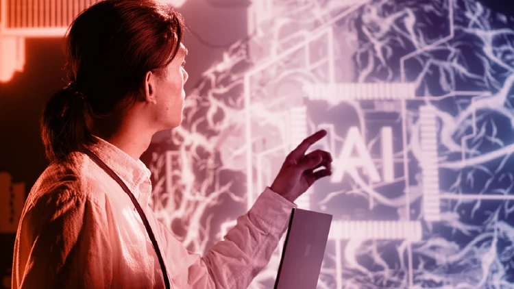 A professional observing a neural representation and an AI icon on a screen, illustrating the need for businesses to adapt to the new European AI Act regulations for transparent artificial intelligence.