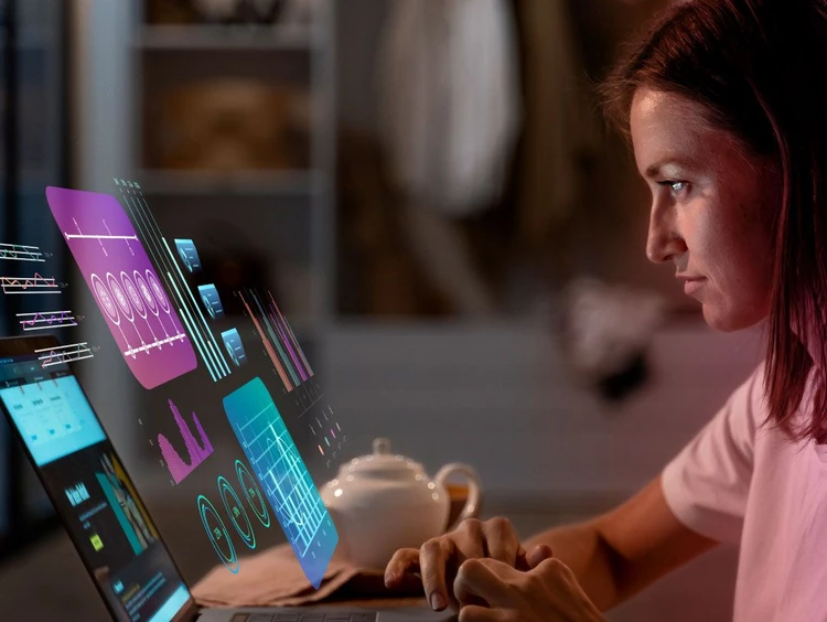 Ragazza osserva una lavagna virtuale con i grafici e svolge analisi.