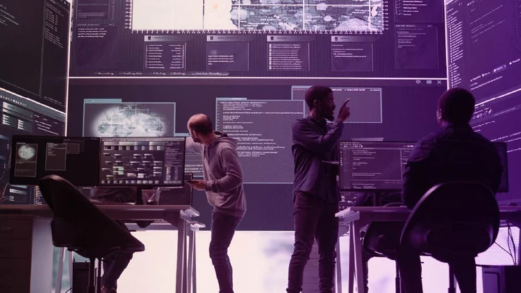 IT professionals team engaged in the supervision and optimization of cloud & infrastructure systems in a high-tech control room.